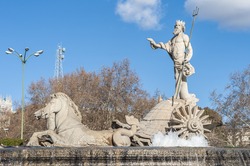 Fountain of Neptune (Fuente de Neptuno), a neoclassical monument designed in 1777 at the center of the Canovas del Castillo square in Madrid, Spain.