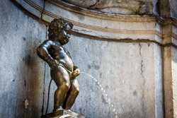 Manneken Pis (Little man Pee) or le Petit Julien, a landmark small bronze sculpture in Brussels, Belgium