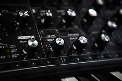 Analog synthesizer device. Professional audio equipment for electronic music production in sound recording studio. 