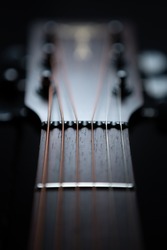 Guitar strings on fingerboard. Professional acoustic musical instrument for wallpaper design. Curated collection of royalty free music images and photos for poster design template