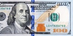 Macro shot of a new 100 dollar bill.