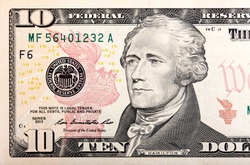 Ten dollars bill fragment of U.S. money in macro.
