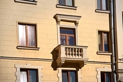 Balcony with with balustrade, old residential building. Stalinist architecture, building on Independence Avenue in Minsk. Stalin Empire style. Balcony of soviet building
