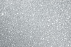 Glittery silver background texture perfect for Luxury, fashion or Christmas and holiday season designs.