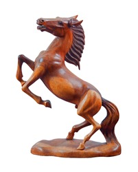Beautiful sculpture of horse made of only one peace of wood isolated on the white background.