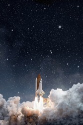 Space shuttle launches in starry sky. Elements of this image furnished by NASA
