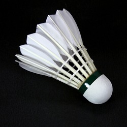 a white shuttlecock isolated on black