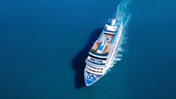 Large Cruise ship sailing across The Mediterranean sea - Aerial image