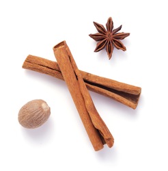 spices as cinnamon stick, anise star and nutmeg isolated on white background