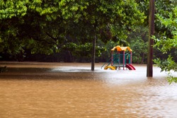 Children's playground under water after heavy rain and flooding in Queensland Australia
