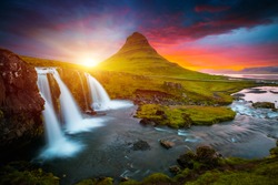 Incredible photo of Kirkjufellsfoss waterfall at sunset. Location famous place Kirkjufell volcano, Iceland, Europe. Image of popular tourist attraction of the world. Discover the beauty of earth.