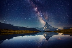 Famous Matterhorn spire under the starry sky. Location Stellisee lake, Cervino peak, Swiss alp, Switzerland, Europe. Photo of popular touristic place. Long exposure shot. Discover the beauty of earth.