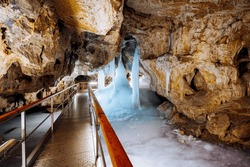 Incredible underground world of the Demanovska ice cave with ice pillars. Location place Low Tatras National Park, Slovakia, Europe. Photo wallpaper. Famous landmarks. Discover the beauty of earth.