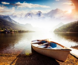 Fantastic views of the morning lake glowing by sunlight. Dramatic and picturesque scene. Location: resort Grundlsee, Liezen District of Styria, Austria, Alps. Europe. Beauty world. Instagram effect.