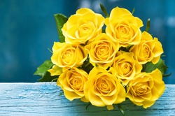 Yellow Roses Bouquet on the blue wood