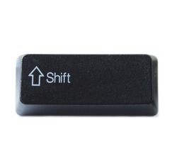 The Shift key from a black computer keyboard