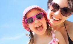 little girl and her mother have  a good time at the seaside resort