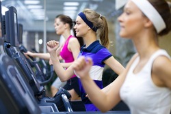 Healthy people  doing fitness exercise  in a sport center