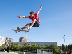 cool skateboard is jumping high in air