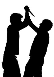 Silhouette of an attack with a knife depicting violence isolated against white background