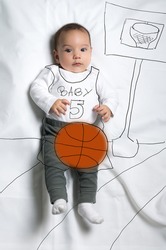 Cute infant baby boy playing basketball sketch