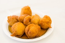 Homemade fritters with sugar and its ingredients, white background