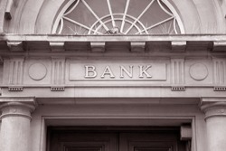 Bank Sign over Entrance Door in Black and White Sepia Tone