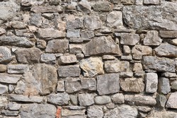 irregular natural stone wall (textured background)