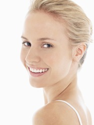 Closeup portrait of a beautiful young blond woman with clean face