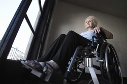Low angle view of a senior woman in wheelchair