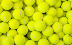 Lots of vibrant tennis balls, pattern of new tennis balls for background 