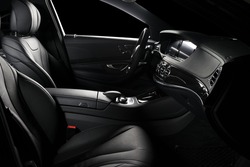 Modern luxury car  black leather interior, clipping path for windows included