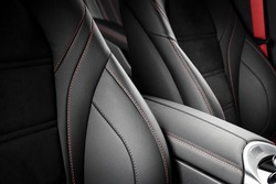 Modern race car  black and red perforated leather interior. Part of  leather car seat details.