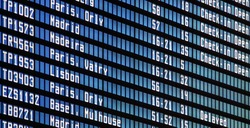 Flights information board at airport terminal 
