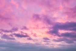 Sunrise clouds skyscape soft pink and purple tones. Majestic summer day cloudy weather. Romantic atmosphere of trendy background illustration desigh in warm pattern. Lovely rose sky panorama shot