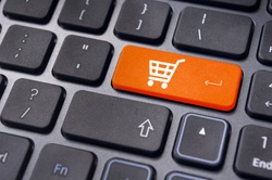 online shopping or internet shop concepts, with shopping cart symbol.