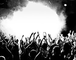 Crowd at a concert with hands up
