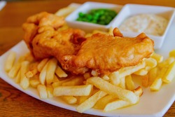 Close up shot of a plate of traditional fish and chips, ate at London, United Kingdom