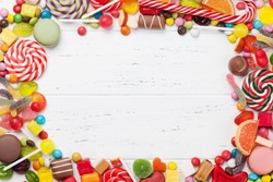 Colorful sweets. Lollipops and candies. Top view with space for your greetings