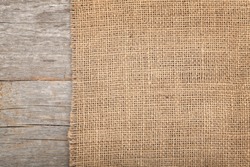 Burlap texture on wooden table background