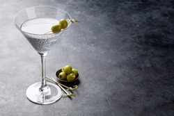 Martini cocktail on dark stone table. With space for your text