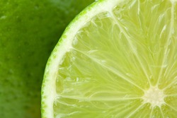 Ripe lime closeup with rind on background