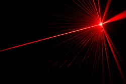 Red laser beam light effect on black background