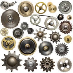 Metal gear, cogwheels, pulleys and clockwork spare parts. 