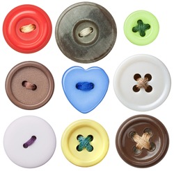 Various sewing buttons with a thread.