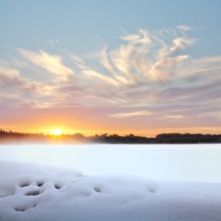 Sunset in winter. Winter landscape.