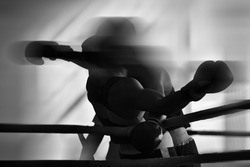 Black and white background image on the theme of boxing.  Combat sports. Silhouettes without faces.