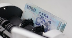 Money counter machine counting New Taiwan dollar