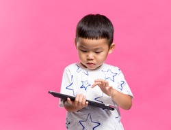 Asian boy using dgital tablet
