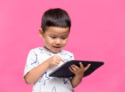 Little kid using dgital tablet